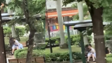 Young lovebirds ignite passion in public park, unfazed by onlookers