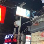 Distraught woman rescued from signboard in Walking Street, Pattaya | Thaiger