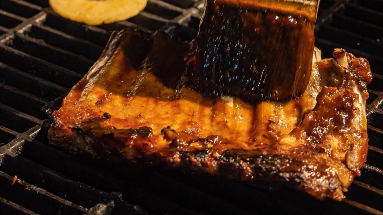 Ribs Half Rack at Roadhouse Barbecye Bangkok is served with corn bread, FF, and coleslaw