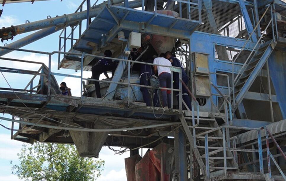 Thai worker falls into cement mixer, saved by off-switch