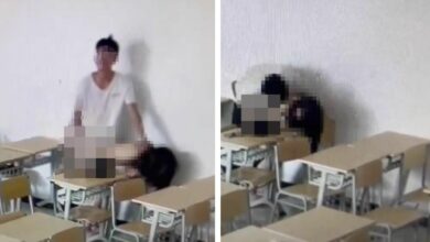 Chinese student couple caught on camera during intimate classroom moment