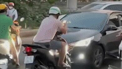 Car driver teaches reckless motorbiker road rage lesson