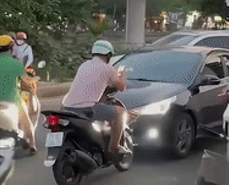 Car driver teaches reckless motorbiker road rage lesson