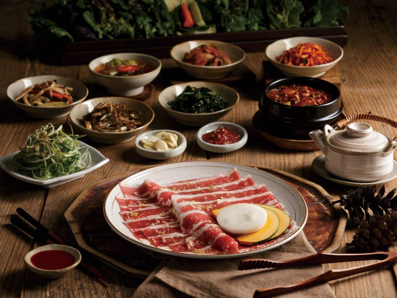 Beef, soup, and banchan in a Korean restaurant in Bangkok, Bornga