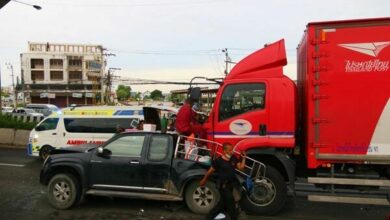 Postal truck crash injures seven and causes traffic chaos