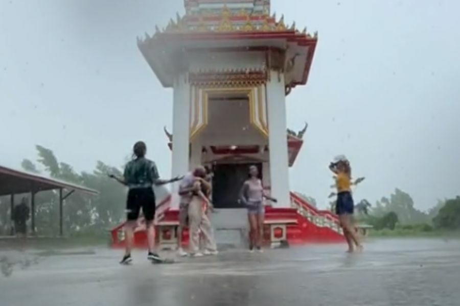 Foreigners make a ‘cremazing’ splash with Gene Kelly-inspired dance in Thai temple rain
