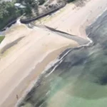 Unexpected black stream on Karon Beach due to natural sedimentation | Thaiger