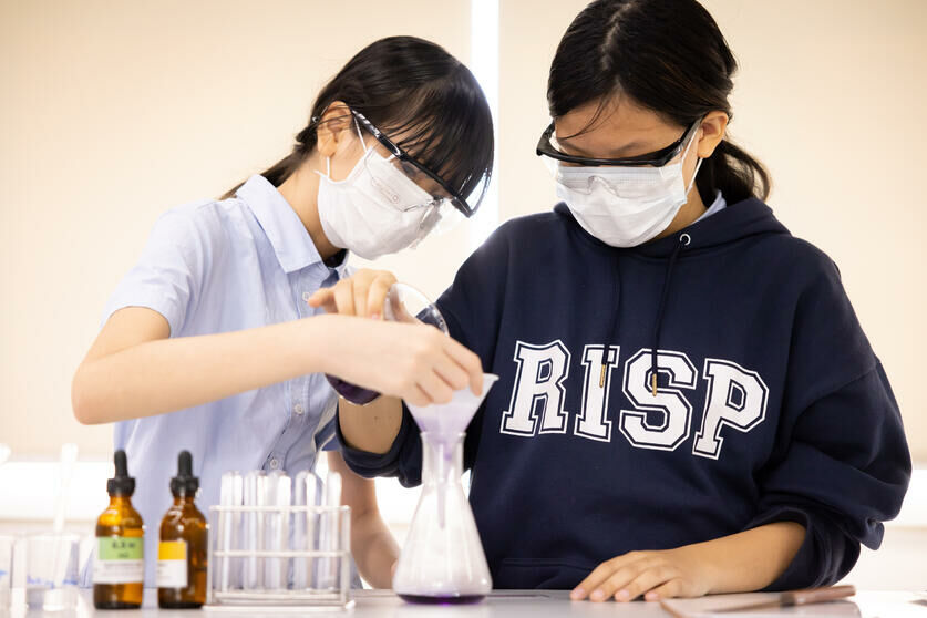 Two female students doing a science experiment at Regents International School Pattaya -