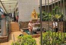 Fat farang strips naked and poops in Bangkok shrine (video)