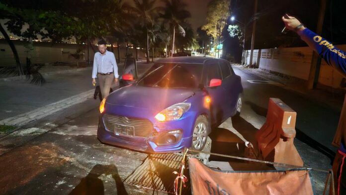 Tourist’s car wheel trapped in poorly covered sewer hole in Sattahip