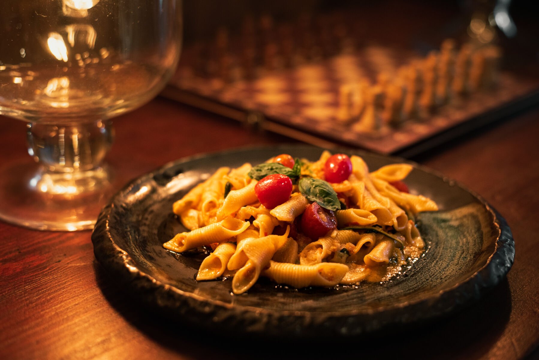 Penne pasta on a table at The Melting Clock, an Italian restaurant and wine lounge in Ekkamai, Bangkok