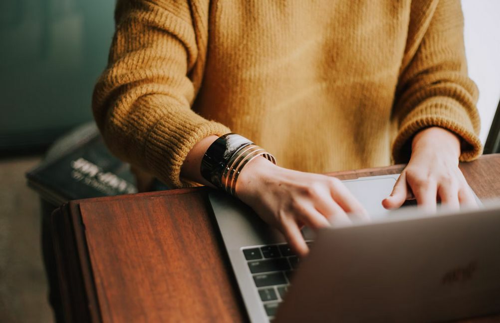 A person who is working to opening a business. Image by Christin Hume, Unsplash