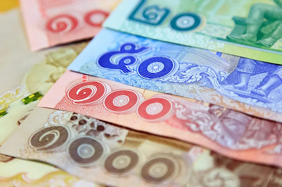 Image of Thai money in cash, 1000 baht, 100 baht, 50 baht, and 20 baht