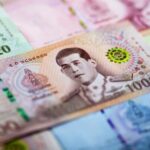 Retired Thai officer covers car in cash to aid the needy | Thaiger