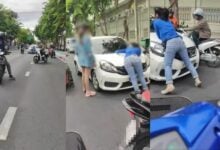 Woman clings to car bonnet in dramatic hit-and-run incident (video)