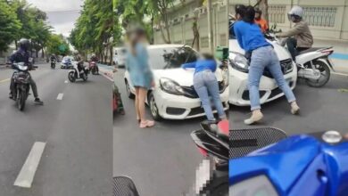 Woman clings to car bonnet in dramatic hit-and-run incident (video)