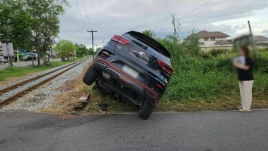 Thai woman survives after SUV collides with train at crossing