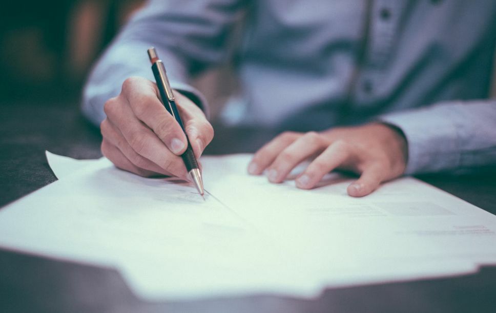 People signing for health insurance