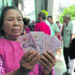 Recipients can use 10,000-baht handout to clear debts: Deputy PM | Thaiger