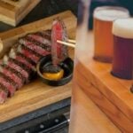 Cheers: Bangkok barbecue offers free beer to Man United fans