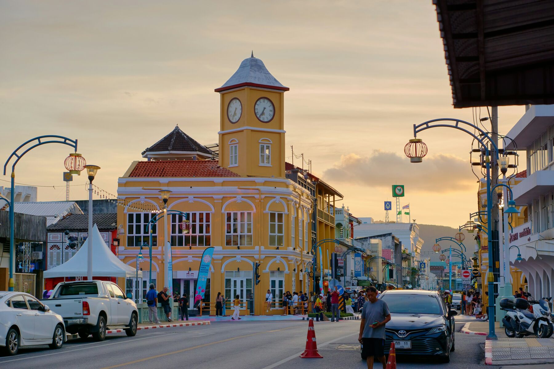 a yellow building with a clock on the top of it