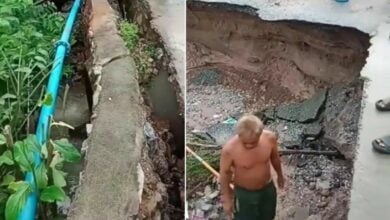 Si Racha road sinks head-deep, residents demand action (video)