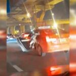 Orange taxi carries motorcycle down Rama II Road, sparks outrage | Thaiger