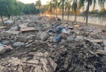 Koh Loi residents face severe rubbish and mud post-flood crisis