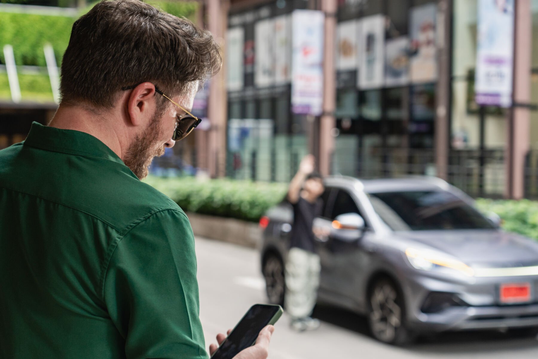 A man ordering Grab Advance Booking