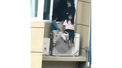 Chinese woman perches kids on 23rd-floor air con amid argument