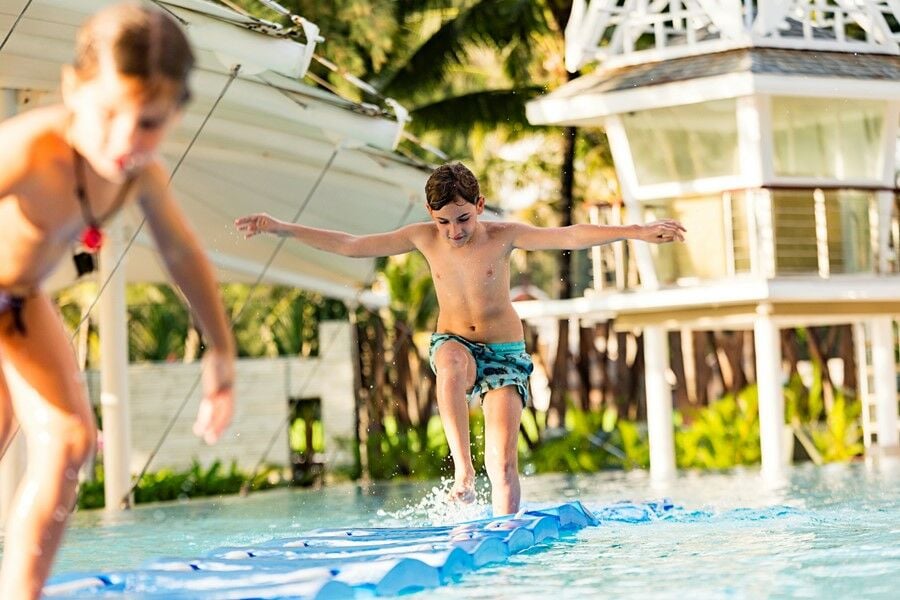 Kids playing at Angsana Laguna Phuket's swimming pool