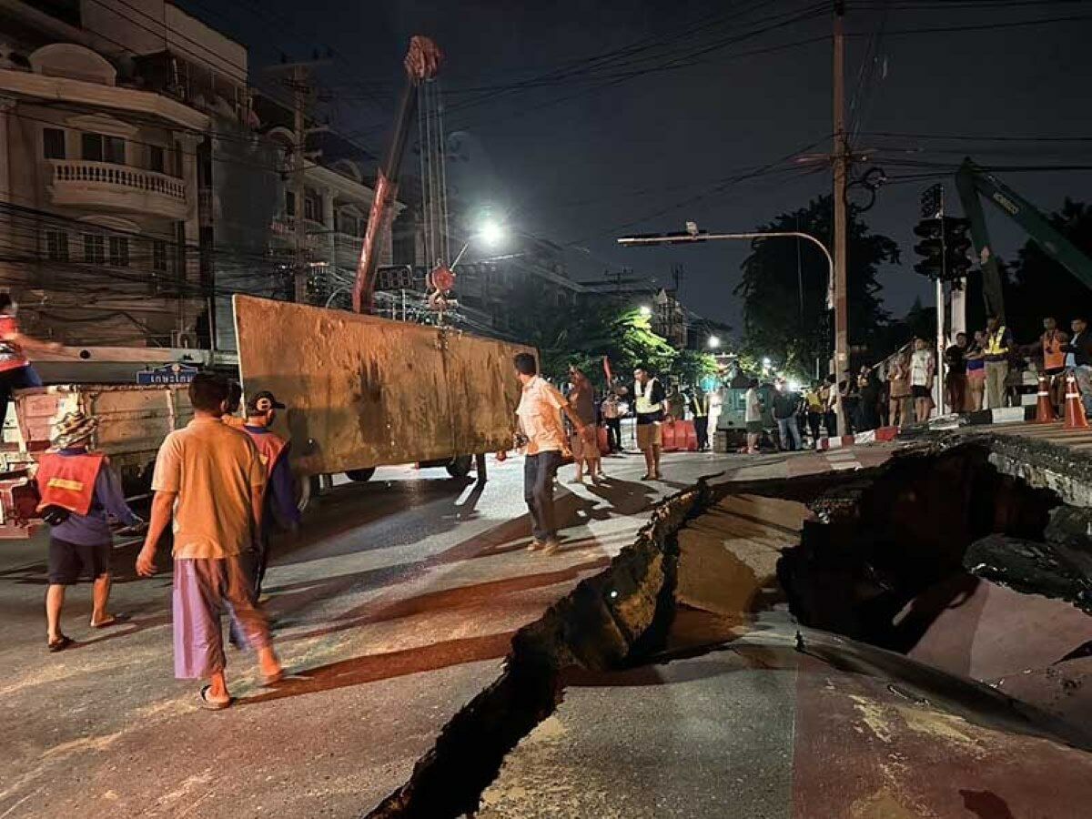 Large sinkhole forces closure of Bangkok bridge road