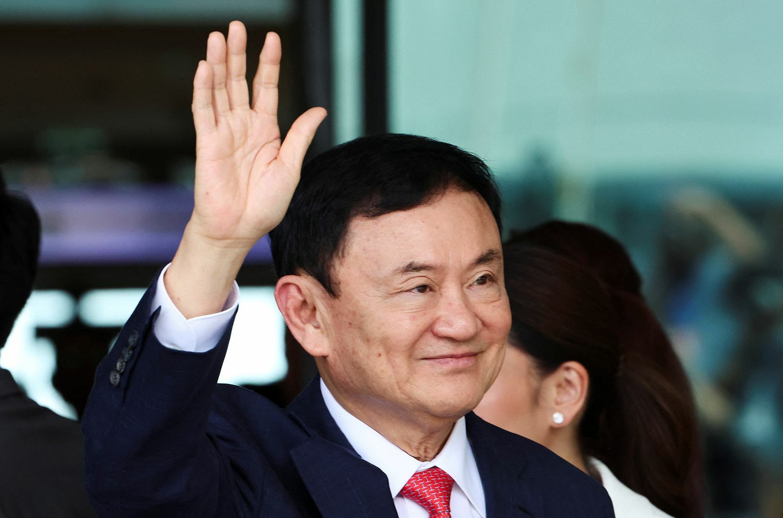 Phew! Thai party faces petition peril over Thaksin ties