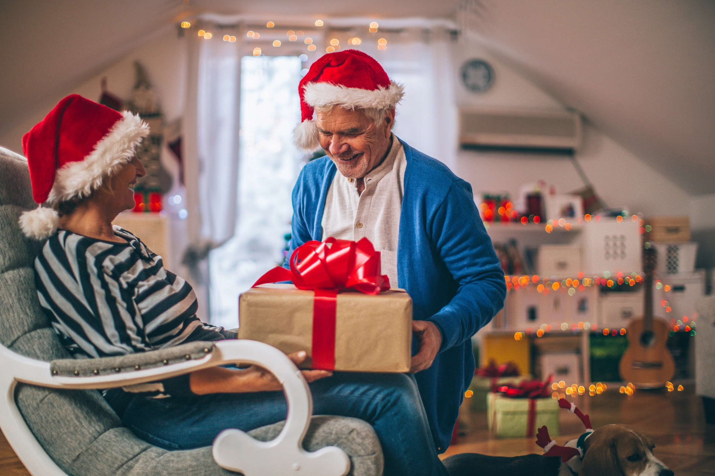 Senior couple celebrating Christmas via AleksandarNakic from Getty Images Signature