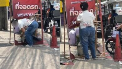 Bangkok market owner removes unauthorised luggage fair sign (video)