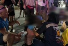 Thai woman glued to phone hit by electric motorcycle in Pattaya