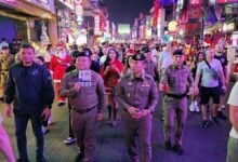 Festive cops hit Pattaya Walking Street with candies