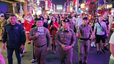 Festive cops hit Pattaya Walking Street with candies