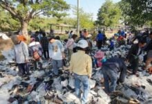 Sole searching: Locals sprint to grab second-hand shoes left in park