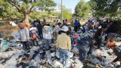 Sole searching: Locals sprint to grab second-hand shoes left in park