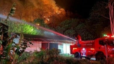 Wildfire reignites, threatening homes and resorts in Korat