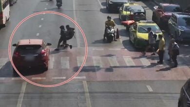 Student injured by car running red light in Bangkok