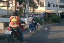 Thai motorcyclist praised for his kindness to disabled man in Bangkok