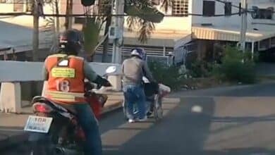 Thai motorcyclist praised for his kindness to disabled man in Bangkok