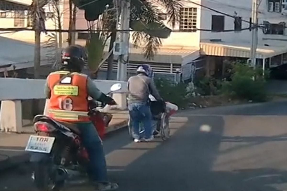 Thai motorcyclist praised for his kindness to disabled man in Bangkok