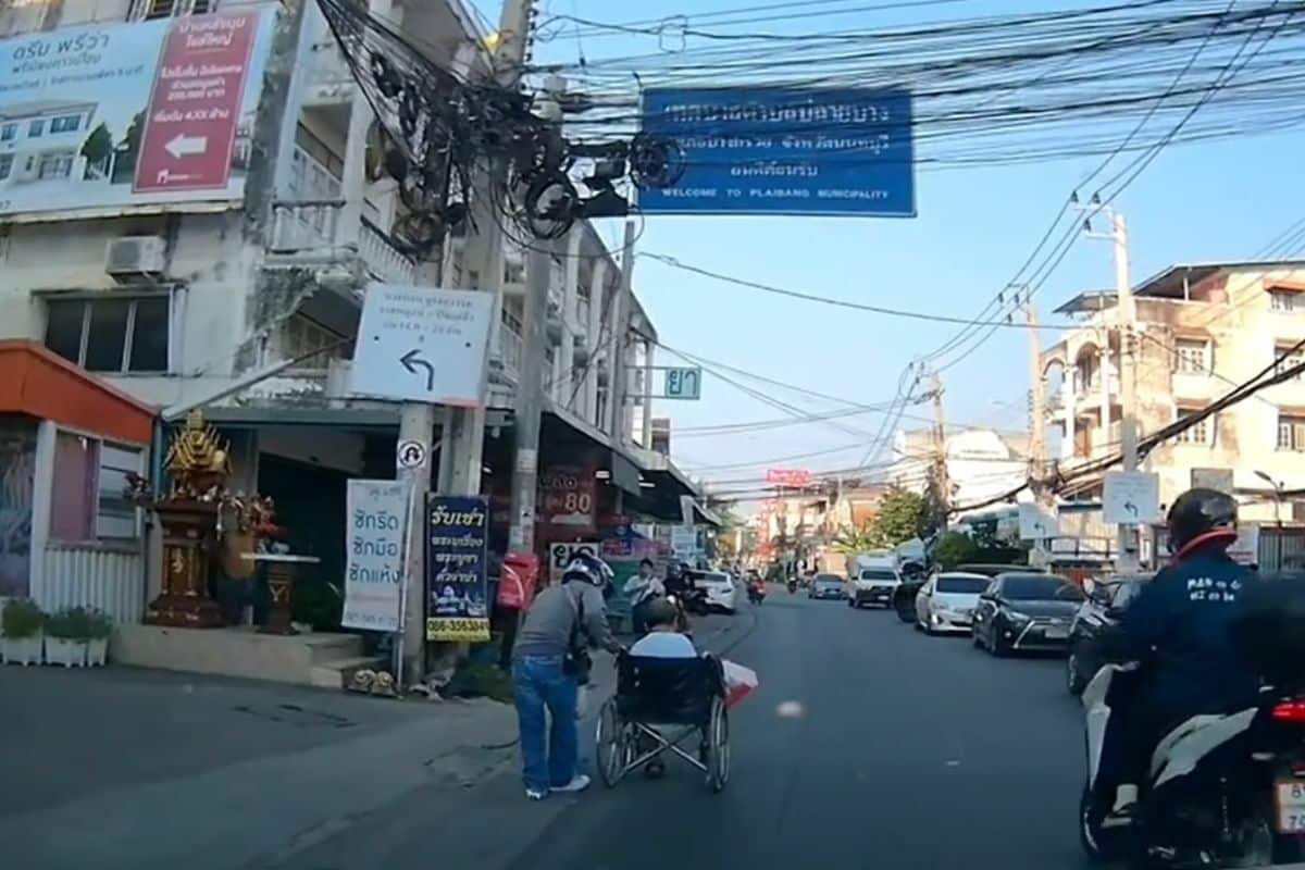 Thai motorcycle rider prised for his act of kindness against disabled man