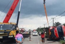 Delivery truck overturns onto pickup, injuring driver in Chumphon