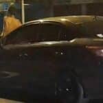 Thai man sits on moving car bonnet after argument with wife