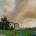 Fire engulfs Rangsit grassland, dangerously close to gas pipeline