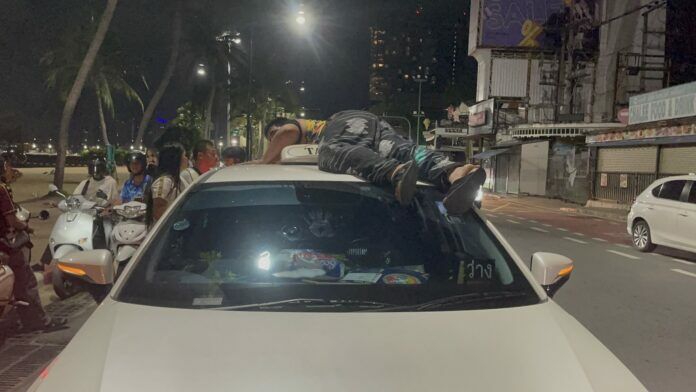 Drunk Indian tourist climbs taxi roof in Pattaya beach meltdown | News by Thaiger